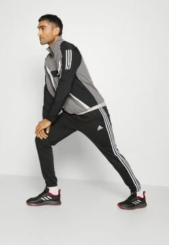 Adidas Performance ESSENTIALS TAPERED CUFF - Tracksuit Bottoms - Black -adidas Performance Shop 0093e02e85c24d388609933666e4d182