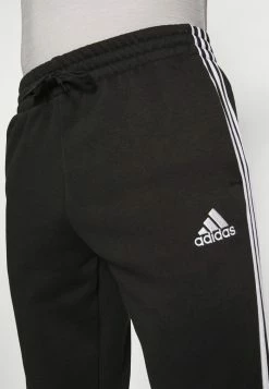 Adidas Performance ESSENTIALS TAPERED CUFF - Tracksuit Bottoms - Black -adidas Performance Shop 425b5d16be3f4e2ba2a635ed81b1d995