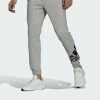 Adidas Performance ESSENTIALS FLEECE TAPERED CUFF LOGO - Tracksuit Bottoms - Grey
