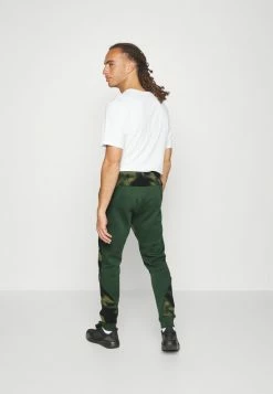 Adidas Performance NATURE AOP POLAR FLEECE - Tracksuit Bottoms - Orbit Green/green Oxide -adidas Performance Shop c7ed14d30d3144e6a29a85b4e1b054c3