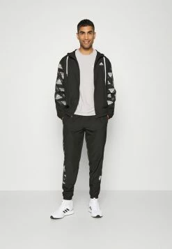 Adidas Performance MTS WOV AOP - Tracksuit - Black -adidas Performance Shop db79caa471174dd5a14736302ee347bd